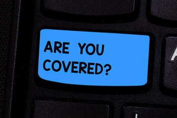 Text sign showing Are You Covered. Conceptual photo Asking about how medications are covered by your plan Keyboard key Intention to create computer message pressing keypad idea