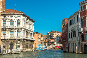 Fototapeta na wymiar Venice Grand Canal with colorful facades of old medieval houses , Italy. Venice is a popular tourist destination of Europe.