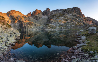 Amazing landscape of The Scary lake during warm summer sunset, Rila mountain national park, Bulgaria