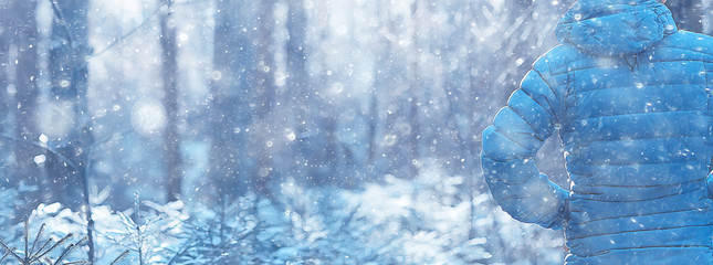 man in sports down jacket landscape winter trekking / down jacket on a tourist, outdoor activities...