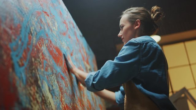 Talented Innovative Female Artist Draws with Her Hands on the Large Canvas, Using Fingers She Creates Colorful, Emotional, Sensual Oil Painting. Contemporary Painter Creating Abstract Modern Art