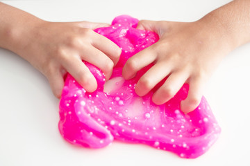 boy playing with hand made toy called slime