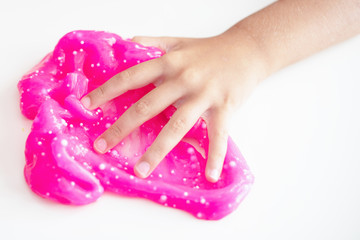 Obraz na płótnie Canvas boy playing with hand made toy called slime