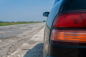 car taillight closeup on the road.