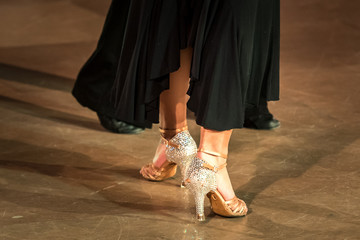 Dancing shoes feet and legs of female and male couple ballroom and latin