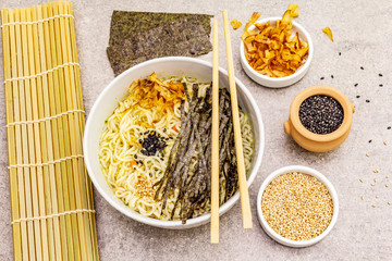 Noodles with seaweed, tuna flakes and sesame seeds
