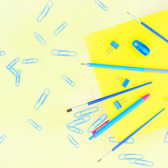 Flat from a variety of stationery on a orange background.