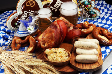 Obraz na płótnie Canvas Traditional German cuisine, Schweinshaxe roasted ham hock. Beer, pretzels and various Bavarian specialties. Oktoberfest background