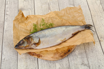 Salted herring over the wooden board