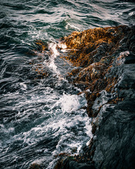 Beautiful waves crashing on rocks