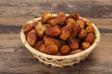 Sweet tasty dry dates in the basket