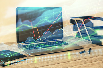 Stock market chart and desktop office computer background. Multi exposure. Concept of financial analysis.