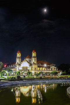 Reflection of Lawang Sewu Architecture at night in Semarang, Indonesia.