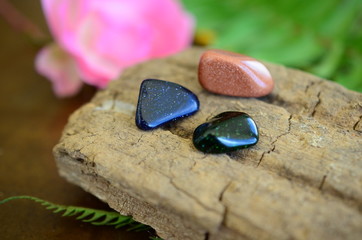 Tumbled Red Goldstone, Blue Goldstone, and Green Goldstone! Sparkling healing crystals, magical witchy stones for reiki healing and energy work! Rainbow of tumbled stones natural lighting photoagraphy