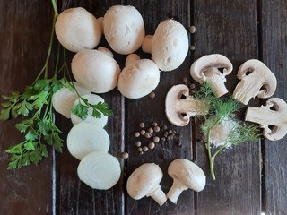 Obraz na płótnie Canvas Still life with fresh mushrooms champignon, onion, herbs.