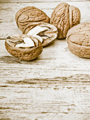 Fresh walnuts on the wooden background