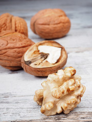 Fresh walnuts on the wooden background