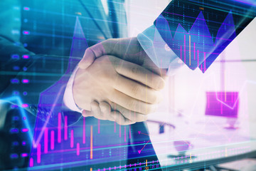 Multi exposure of financial graph on office background with two businessmen handshake. Concept of success in business