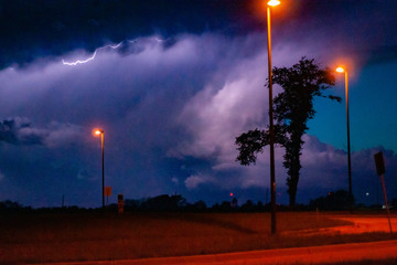 Lightning bolt on vivid purple night sky