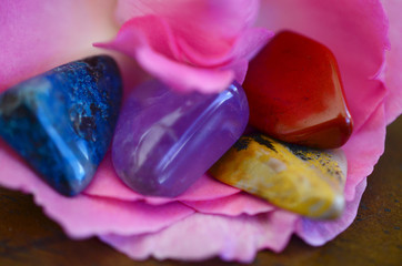 Crystal Medicine Bag; Chrysocolla, Amethyst, Red Jasper, and Ocean Jasper! Small, pocket sized crystal bundle. Beautiful rainbow assortment of crystals on wooden desk, natural lighting Colorful bright