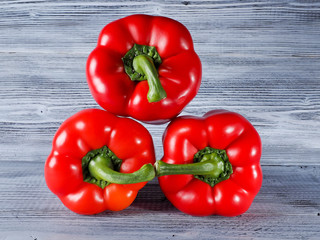 Red Peppers on the wooden background