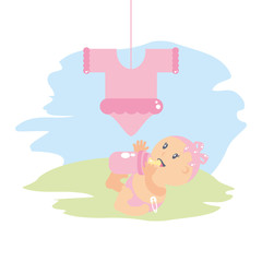 cute baby girl with bottle milk and clothes for baby