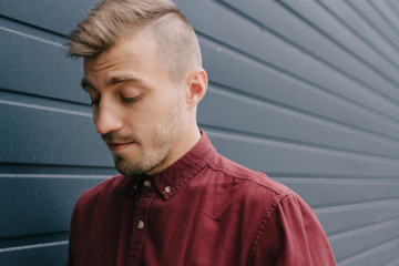 Man looking down on grey background