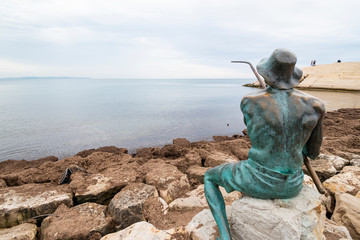 Fisherman sculpture at Vollga Waterfront Promenade