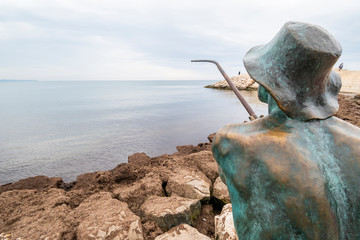 Fisherman sculpture at Vollga Waterfront Promenade