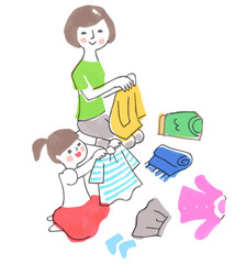 洗濯物をたたむ親子