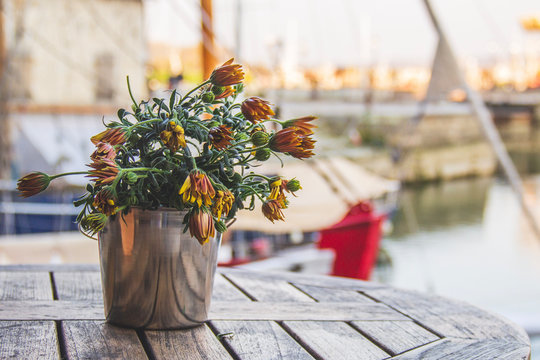 bouquet of flowers in a vase on wooden table