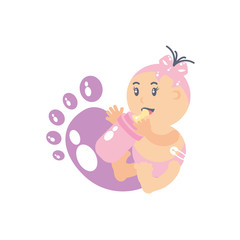 cute baby girl with bottle milk and footprint decoration