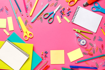 Flat lay composition of school supplies on a pink background. Place for text. Top view. Teacher's Day. Back to school.
