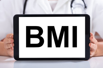 Doctor's Hand Holding Digital Tablet With Blank White Screen