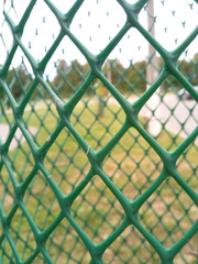 Fototapeta premium street plastic green fence net