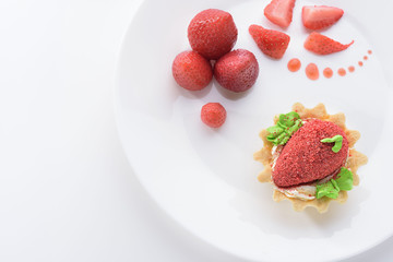 strawberry dessert on a white plate. White background. Strawberry.