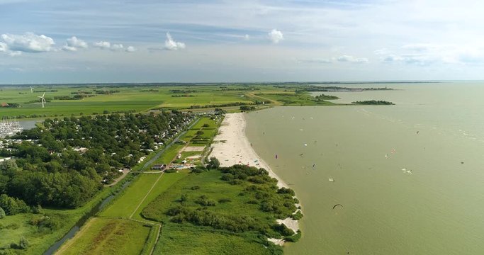 Kitesurfers on the Beach of Workum, Friesland, The Netherlands / Holland 4K Drone Footage