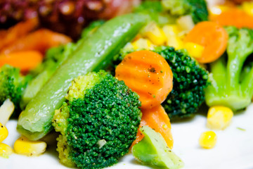 Healthy eating. Mixed vegetables on a plate close up.