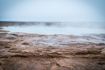 Icelandic winter with geyser thermal activity 
