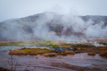 Naklejka na ściany i meble Icelandic winter with geyser thermal activity 
