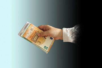 emale hand with a bundle of euro paper money, business concept, horizontal, close-up, copy space