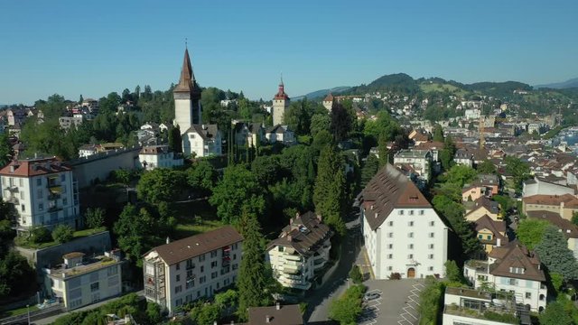 flight over luzern city famous castle summer day sunset time aerial panorama 4k switzerland