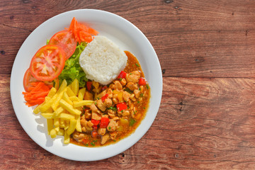 Chess chicken with rice, fries and salad sides