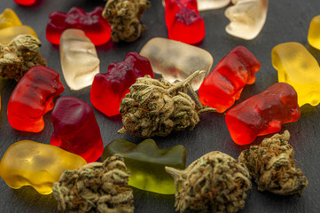Cannabis edibles, medical marijuana, CBD infused gummies and edible pot concept theme with close up...