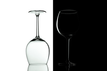 Clean Empty wine glasses with reflections on black and white background. Alcohol beverage card backdrop.