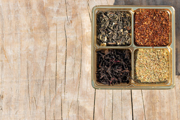 Assorted four types of dry tea: green, black leaf, rooibos super