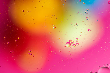 Abstract background, colorful gradient colors. Oil drops in water.
