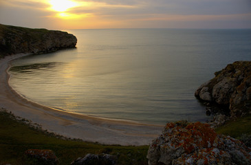 sunset on coast of sea