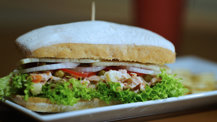 tuna sandwich with tomato onion and lettuce for breakfast
