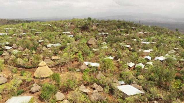 Drone flight over classic houses built with straw in traditional Konso tribal community in Southern Ethiopia